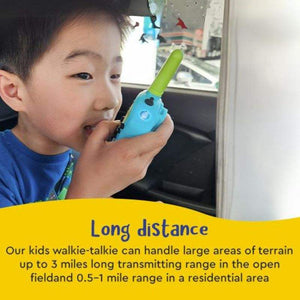 Child using a blue kids walkie talkie with long distance range for outdoor communication