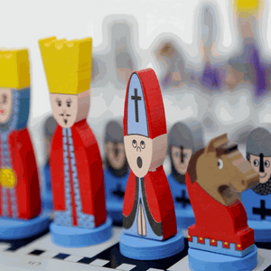 Educational Wooden Cartoon Chess Set with colorful wooden cartoon-style chess pieces on a chessboard, designed for kids' learning and fun.