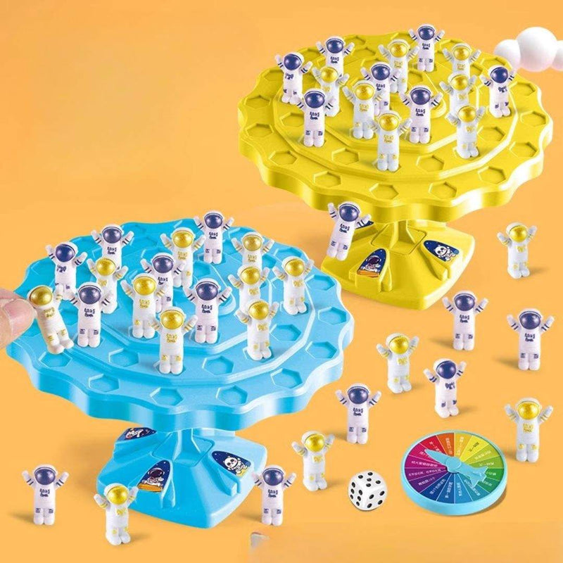Balance Astronaut Stacking Game for kids with colorful plastic astronauts and dice on a white background