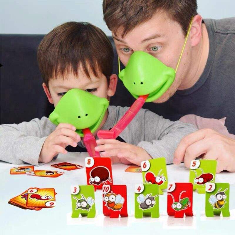 Family playing Frog Mouth Tongue-Out soft rubber table game with interactive frog toy and colorful pieces