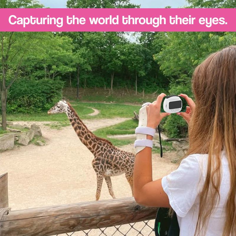 PocketLens Explorer Kids Camera in bright orange with wrist strap, compact and durable design for children aged 6+