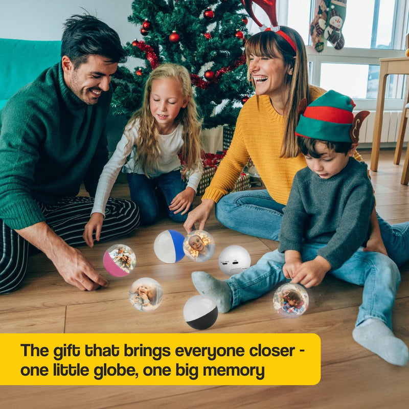 Family enjoying Christmas with video memory crystal globes displaying 3D holographic photos and videos